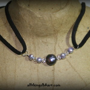 A black leather choker with Pearls and Swarovski crystals. A BA original design.