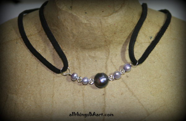 A black leather choker with Pearls and Swarovski crystals. A BA original design.