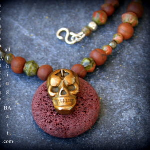 Lave,unikite, red serpentine and pyrite, skull necklace. An original BA design